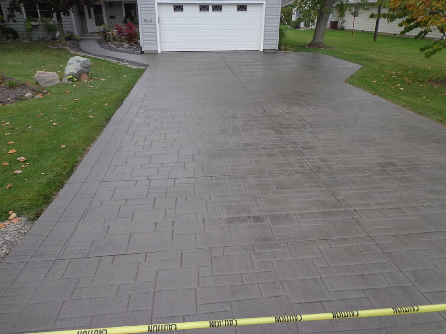 A straight concrete driveway for a garage in Fort Worth TX