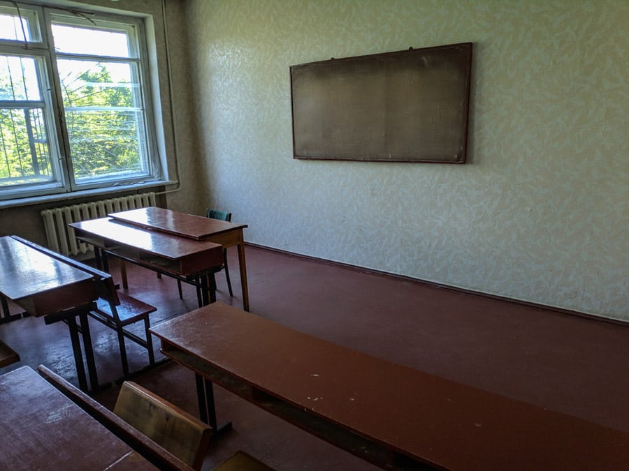 an old facility with stained concrete floor