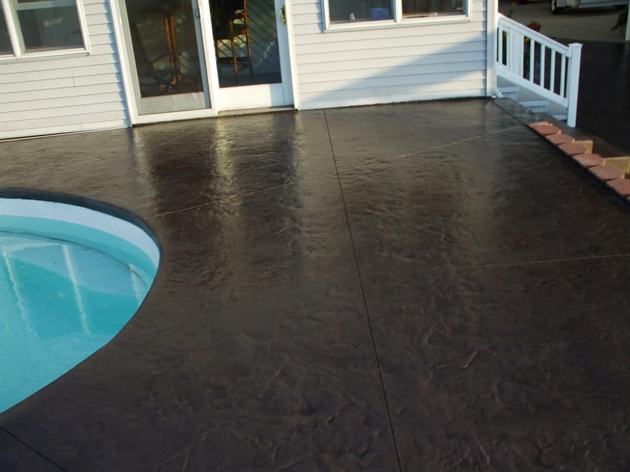 A pool deck for a house backyard